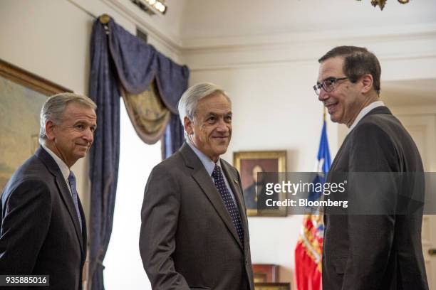 Felipe Larrain, Chile's finance minister, from left, Sebastian Pinera, Chile's president, and Steven Mnuchin, U.S. Treasury secretary, stand for a...