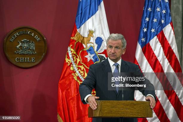 Felipe Larrain, Chile's finance minister, listens during a press conference with Steven Mnuchin, U.S. Treasury secretary, not pictured, at La Moneda...