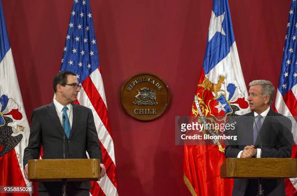Felipe Larrain, Chile's finance minister, right, speaks while Steven Mnuchin, U.S. Treasury secretary, listens during a press conference at La Moneda...