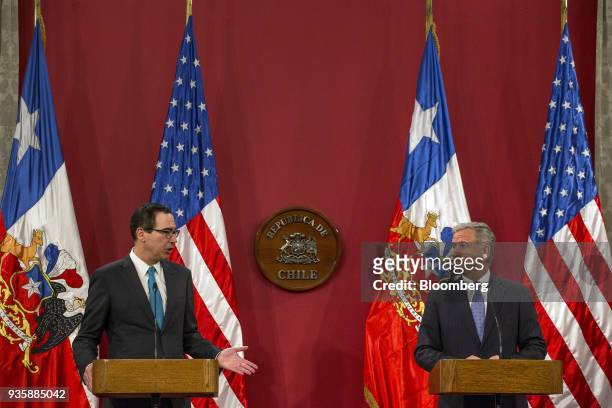 Steven Mnuchin, U.S. Treasury secretary, left, speaks while Felipe Larrain, Chile's finance minister, listens during a press conference at La Moneda...