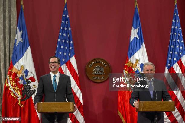 Steven Mnuchin, U.S. Treasury secretary, left, and Felipe Larrain, Chile's finance minister, smile during a press conference at La Moneda Palace in...