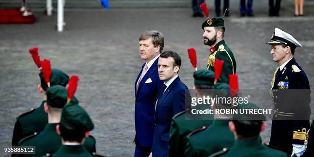 Dutch king Willem-Alexander welcomes French president Emmanuel Macron at the Palace Noordeinde in The Hague, on March 21, 2018. / AFP PHOTO / ANP /...