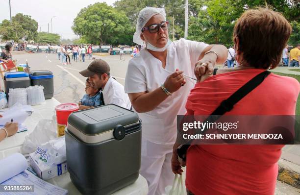 Venezuelan woman is vaccinated against measles in Cucuta, Colombia, at the international brigde Simon Bolivar on the border with Venezuela, on March...