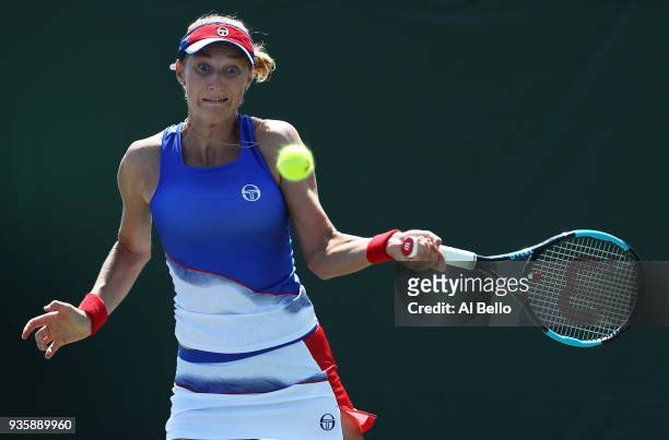 Ekaterina Makarova of Russia plays a shot against Timea Bacsinszky Switzerland during Day 3 of the Miami Open at the Crandon Park Tennis Center on...