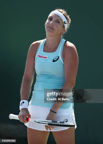 Timea Bacsinszky of Switzerland reacts to a lost point against Ekaterina Makarova of Russia during Day 3 of the Miami Open at the Crandon Park Tennis...