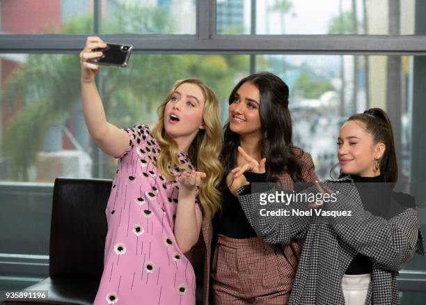 Kathryn Newton, Geraldine Viswanathan and Gideon Adlon take a selfie together at "Extra" at Universal Studios Hollywood on March 21, 2018 in...