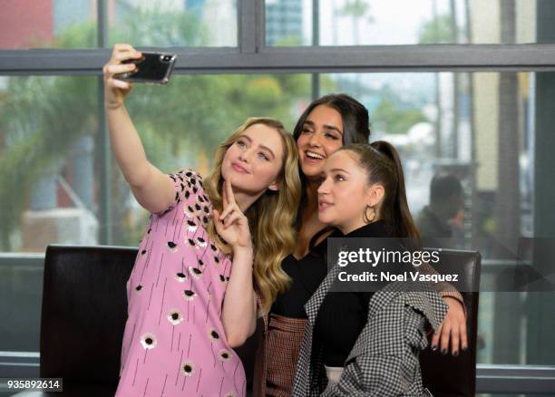 Kathryn Newton, Geraldine Viswanathan and Gideon Adlon take a selfie together at "Extra" at Universal Studios Hollywood on March 21, 2018 in...