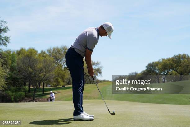 Luke List of the United States putts with a wedge on the 18th green during the first round of the World Golf Championships-Dell Match Play at Austin...