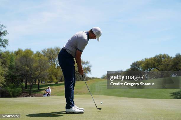 Luke List of the United States putts with a wedge on the 18th green during the first round of the World Golf Championships-Dell Match Play at Austin...