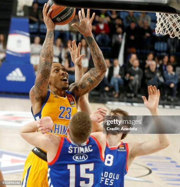 Vladimir Stimac and Birkan Batuk of Anadolu Efes in action against Malcolm Thomas of Khimki during the Turkish Airlines Euroleague week 27 basketball...