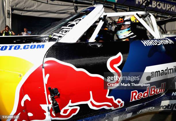 Daniel Ricciardo of Australia and Red Bull Racing with drifiting superstar Mad Mike during previews ahead of the Australian Formula One Grand Prix at...