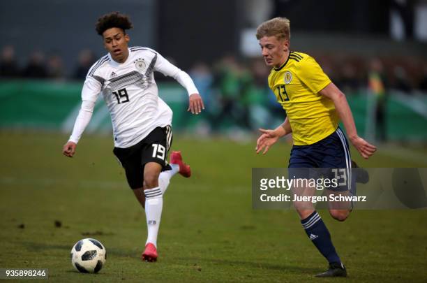Linton Maina of Germany and Matthew Shiels of Scotland fight for the ball during the Under 19 Euro Qualifier between Germany and Scotland on March...