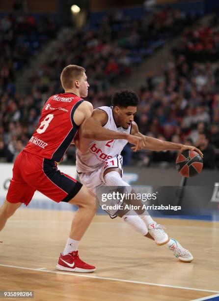 Augustine Rubit, #21 of Brose Bamberg competes with Rinalds Malmanis, #8 of Baskonia Vitoria Gasteiz during the 2017/2018 Turkish Airlines EuroLeague...