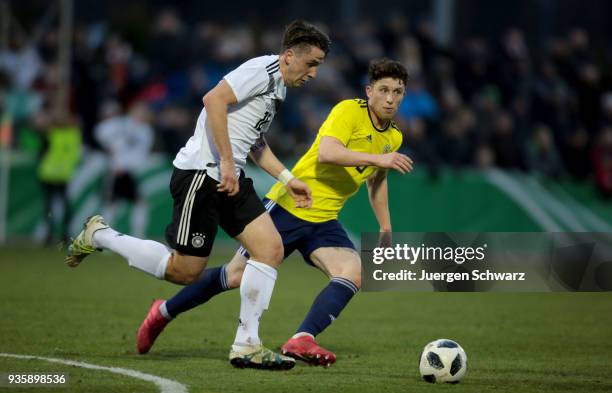 Adrian Fein of Germany and Jamie Barjonas of Scotland fight for the ball during the Under 19 Euro Qualifier between Germany and Scotland on March 21,...