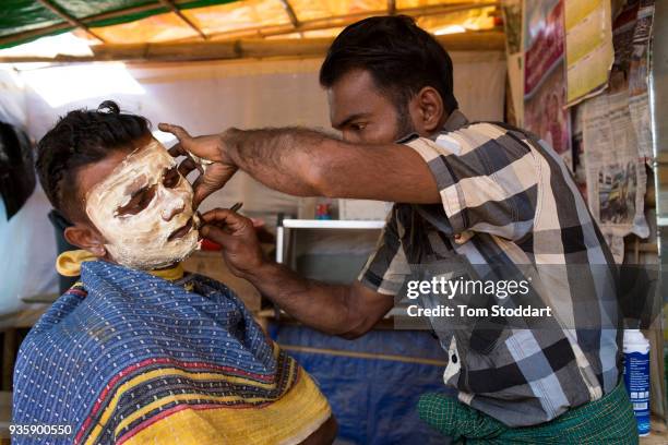 Rohingya man is shaved by a barber at the Kutupalong refugee camp on February 29, 2018 at Cox's Bazar, Bangladesh. Over 655,000 Rohingya have arrived...