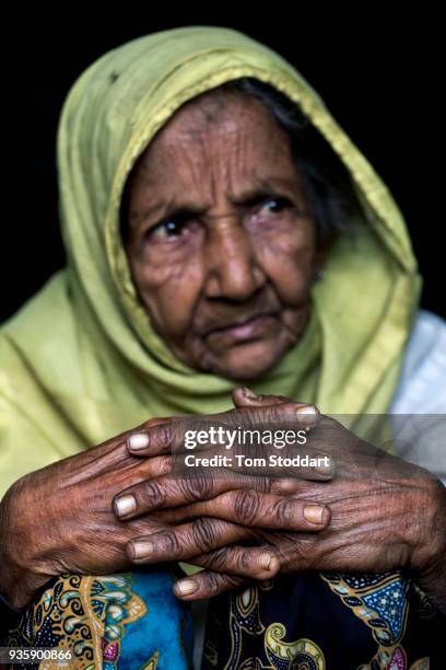 Supia Katun photographed in Kutupalong refugee camp on February 27, 2018 at Cox's Bazar, Bangladesh. The elderly lady was carried by relatives for 3...