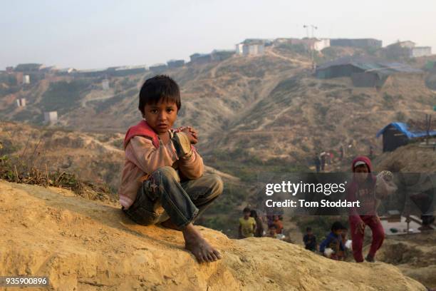 Rohingya boy sits at Kutupalong refugee camp on February 26, 2018 near Cox's Bazar, Bangladesh. Over 655,000 Rohingya have arrived in the area since...