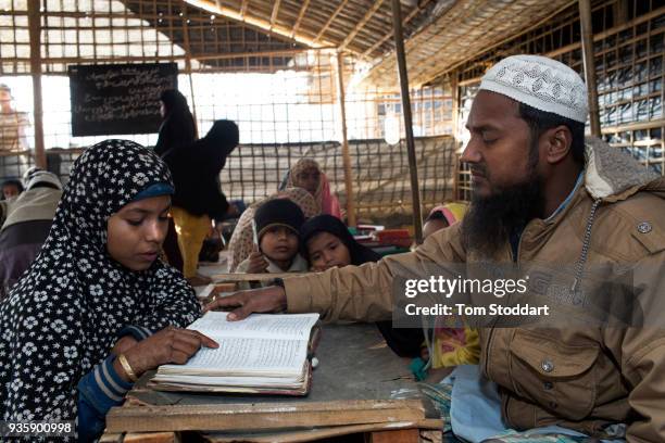 Iman Abdul Salam teaches Rohingya children the Koran at a mosque in Balukali refugee camp on February 28, 2018 at Cox's Bazar, Bangladesh. Over...