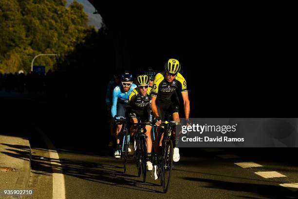 Rob Power of Australia and Simon Yates of Great Britan and Team Mitchelton-Scott and lead the peloton as they head up the Coll de Collabos during the...