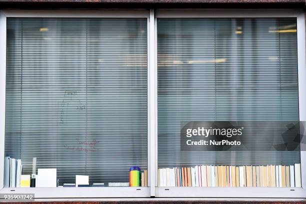 Writing is seen on the glass of a window at the London headquarters of Cambridge Analytica, London on March 21, 2018. Authorities are currently...
