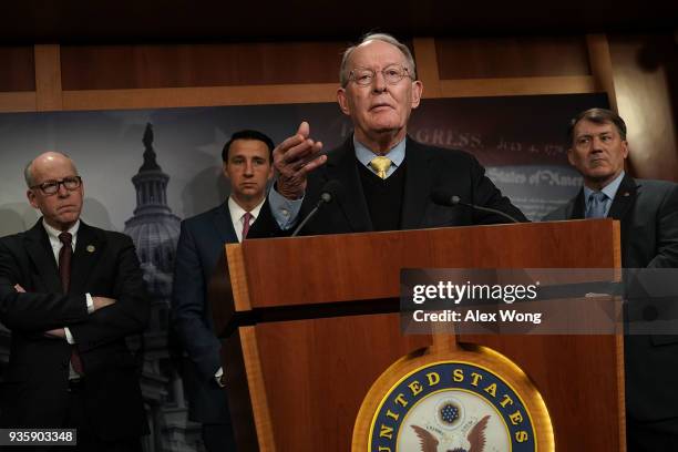 Sen. Lamar Alexander speaks as Rep. Greg Walden , Rep. Ryan Costello and Sen. Mike Rounds listen during a news conference at the Capitol March 21,...