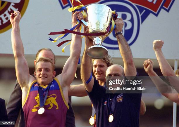 Brisbane Captain Michael Voss and coach Leigh Matthews celebrate after Brisbane defeated Essendon, after the 2001 AFL Grand Final match between the...
