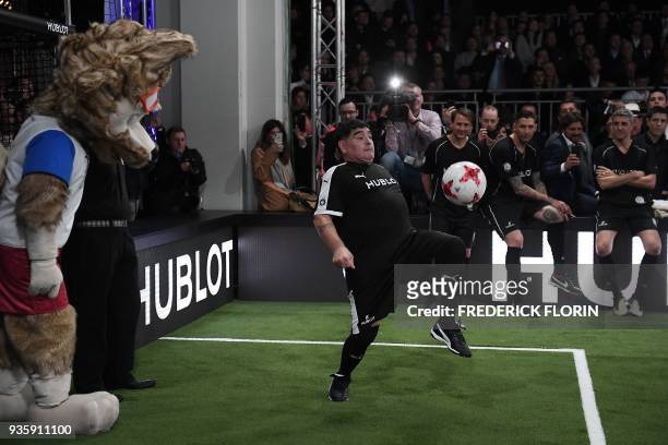 Argentina's Diego Armando Maradona takes part in an exhibition football game organised by watchmaker Hublot during the press day on the eve of the...