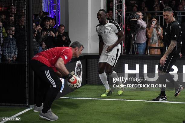 Retired Jamaican Olympic and World champion sprinter Usain Bolt takes part in an exhibition football game organised by watchmaker Hublot during the...