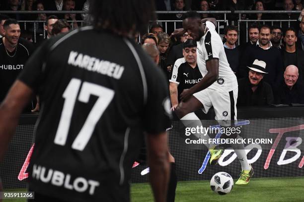 Retired Jamaican Olympic and World champion sprinter Usain Bolt takes part in an exhibition football game organised by watchmaker Hublot during the...