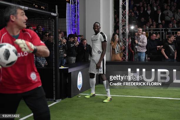 Retired Jamaican Olympic and World champion sprinter Usain Bolt takes part in an exhibition football game organised by watchmaker Hublot during the...