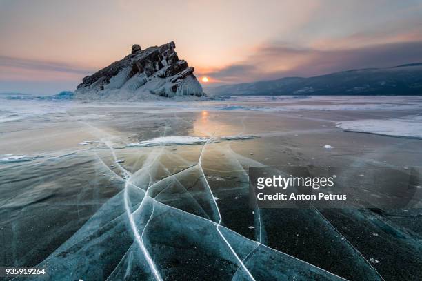 elenka island on lake baikal in winter - frozen lake sunset stock pictures, royalty-free photos & images