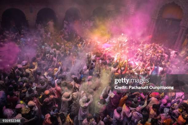 people celebrating holi festival in mathura city - uttar pradesh assembly stock pictures, royalty-free photos & images