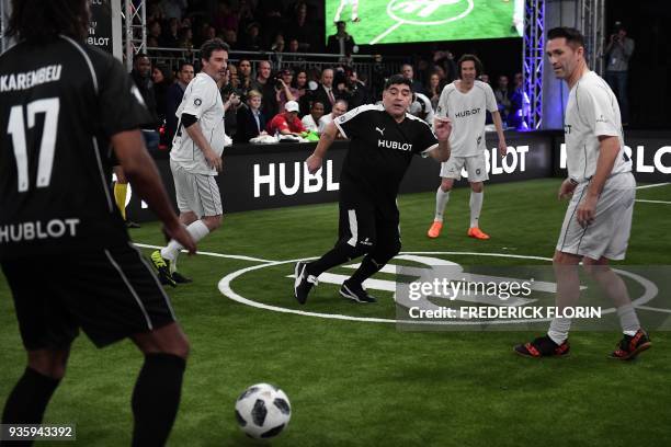 Argentina's Diego Armando Maradona takes part in an exhibition football game organised by watchmaker Hublot during the press day on the eve of the...