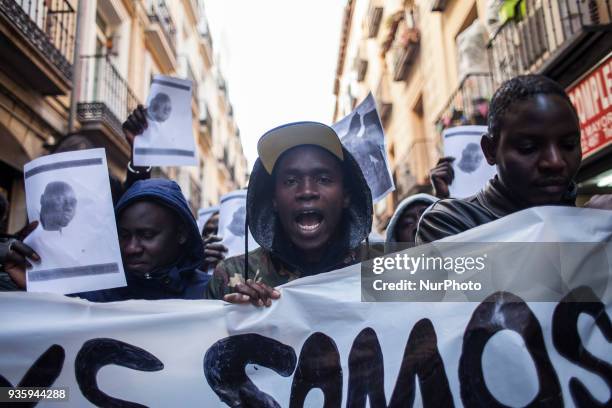 Protesters shout against racism and racist raids on 21 March 2018 in Madrid, Spain. AISE calls a demonstration in memory of the two Senegalese killed...