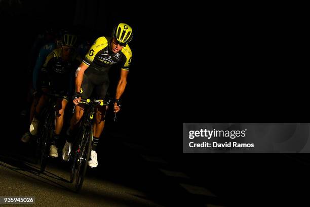 Rob Power of Australia and Simon Yates of Great Britan and Team Mitchelton-Scott and lead the peloton as they head up the Coll de Collabos during the...