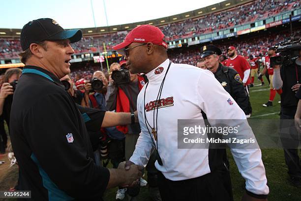 Head coach Mike Singletary of the San Francisco 49ers shakes hands with head coach Jack Del Rio of the Jacksonville Jaguars after the NFL game at...