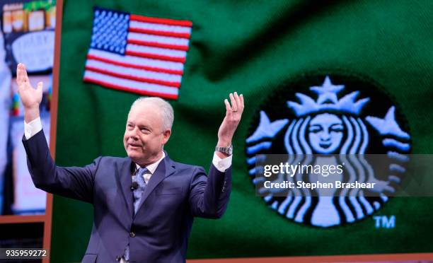 Starbucks CEO Kevin Johnson gestures while speaking during the Starbucks annual shareholders meeting at McCaw Hall on March 21, 2018 in Seattle,...