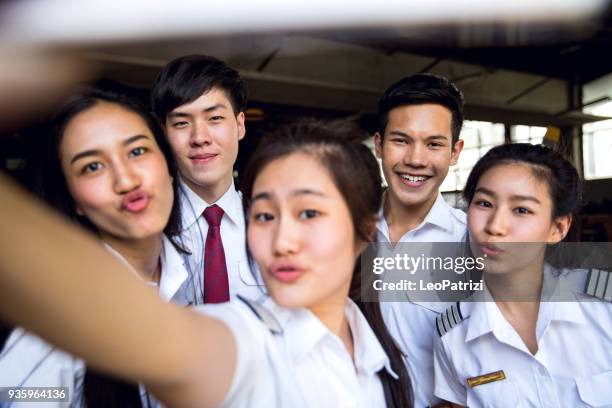 aviation university students attending to class - flight suit stock pictures, royalty-free photos & images