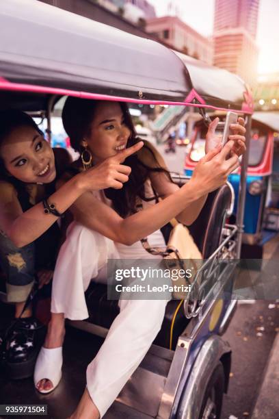 friends traveling in bangkok - thailand - jinrikisha stock pictures, royalty-free photos & images