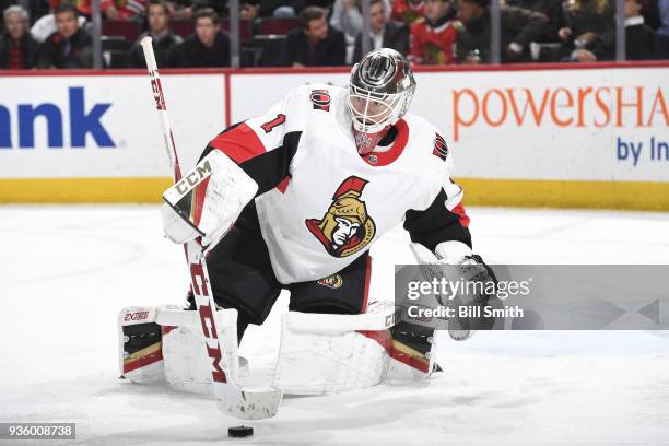 Goalie Mike Condon of the Ottawa Senators stops the puck in the first period against the Chicago Blackhawks at the United Center on February 21, 2018...