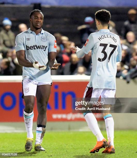Michail Antonio of West Ham United celebrates scoring with Nathan Holland during the friendly match between Dagenham and Redbridge and West Ham...