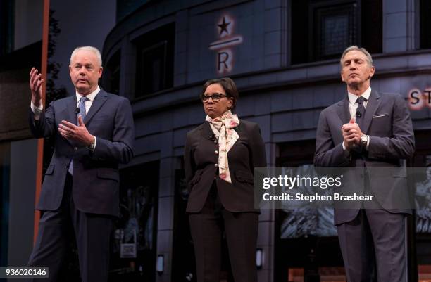 Starbucks CEO Kevin Johnson, left, answers questions during the Starbucks Annual Shareholders Meeting while Starbucks Chief Operating Officer Roz...