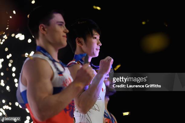 Winner of the Silver medal, Nikita Nagornyy, Gold medalist, Shogo Nonomura of Japan and Bronze Medalist, James Hall of Great Britain celebrate their...