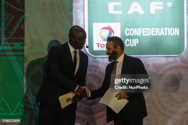 Former Zamalek midfielder Hazem Emam assist CAF Deputy General Secretary Anthony Baffoe to conduct the draw on Wednesday, 21 March 2018 in Cairo,...