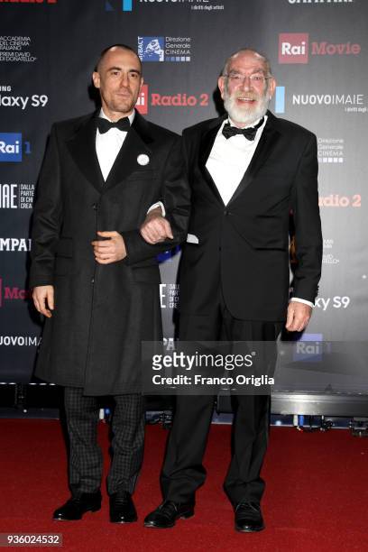 Elio Germano and Renato Carpentieri walk a red carpet ahead of the 62nd David Di Donatello awards ceremony on March 21, 2018 in Rome, Italy.