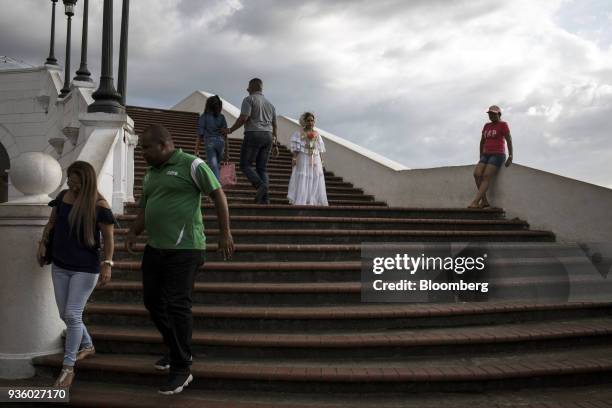 Person in traditional Panamanian clothing stands for a photograph at Plaza Francia in the Casco Viejo neighborhood of Panama City, Panama, on Sunday,...