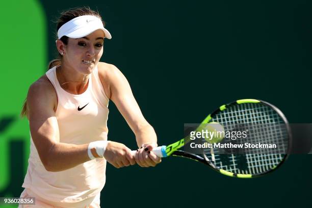 Catherine 'CiCi' Bellis returns a shot to Victoria Azarenka of Belarus during the Miami Open Presented by Itau at Crandon Park Tennis Center on March...