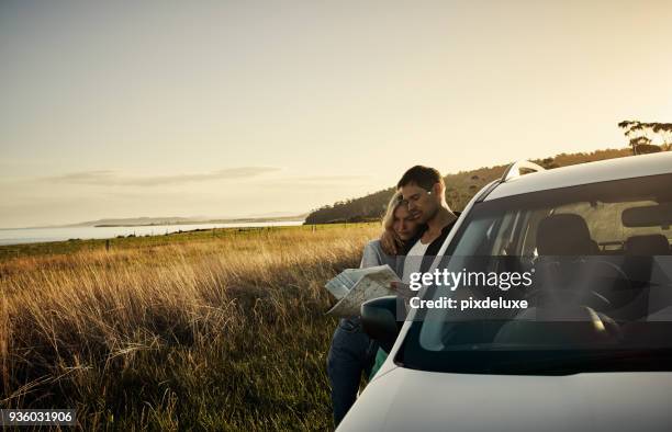 we can decide where to go together - couple-reading-map stock pictures, royalty-free photos & images