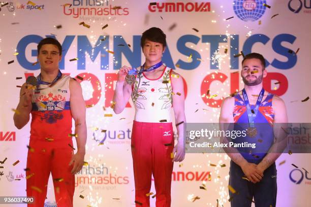 Winner of the Silver medal, Nikita Nagornyy, Gold medalist, Shogo Nonomura of Japan and Bronze Medalist, James Hall of Great Britain celebrate their...