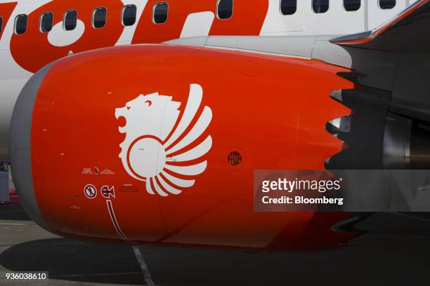 Lion Air Group livery is displayed on the engine of a Boeing Co. 737 Max 9 aircraft during a ceremony at the Boeing delivery center in Seattle,...